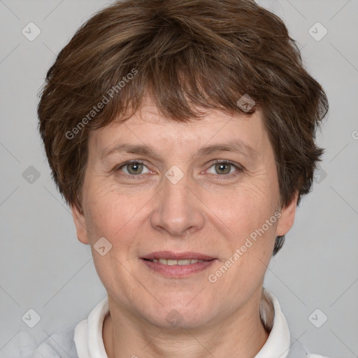 Joyful white adult female with short  brown hair and brown eyes