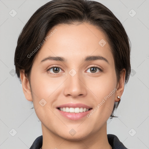 Joyful white young-adult female with medium  brown hair and brown eyes