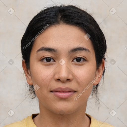 Joyful latino young-adult female with medium  brown hair and brown eyes