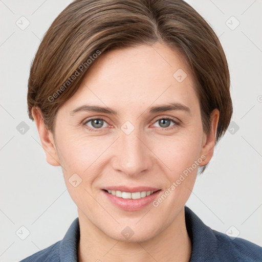 Joyful white young-adult female with short  brown hair and grey eyes