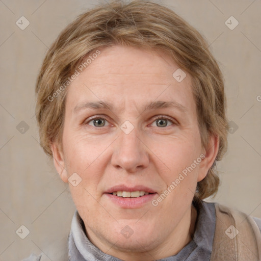 Joyful white adult female with medium  brown hair and grey eyes