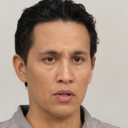 Neutral asian adult male with short  black hair and brown eyes