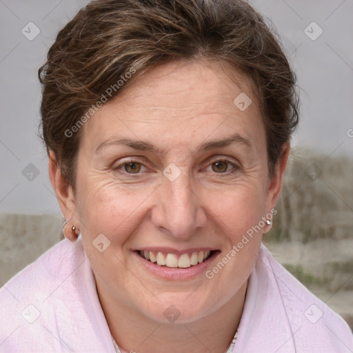 Joyful white adult female with short  brown hair and brown eyes