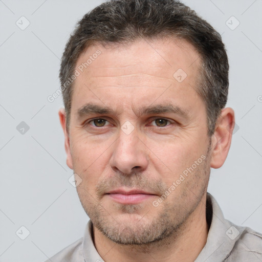 Neutral white adult male with short  brown hair and brown eyes