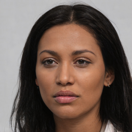 Neutral latino young-adult female with long  black hair and brown eyes