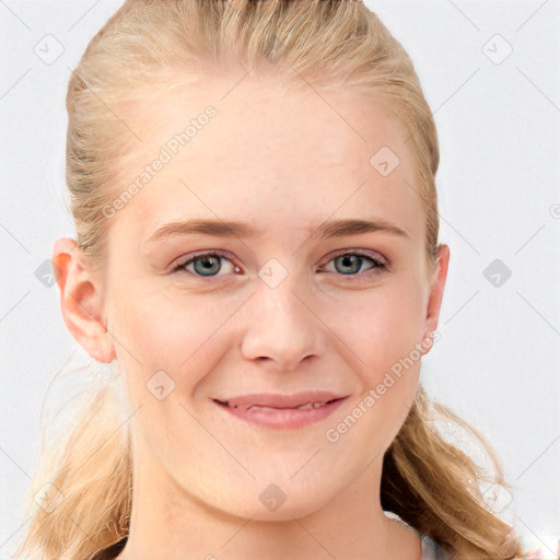 Joyful white young-adult female with long  brown hair and blue eyes