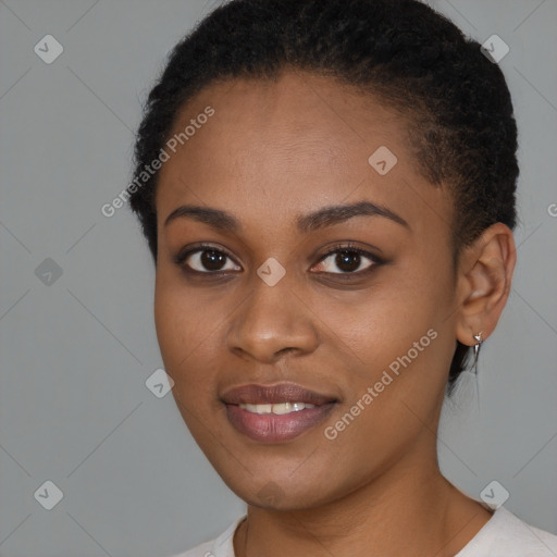 Joyful black young-adult female with short  brown hair and brown eyes