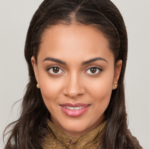 Joyful white young-adult female with long  brown hair and brown eyes