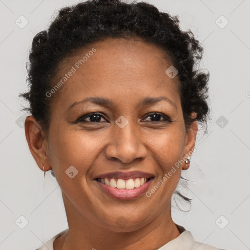 Joyful black adult female with short  brown hair and brown eyes