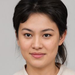 Joyful white young-adult female with medium  brown hair and brown eyes