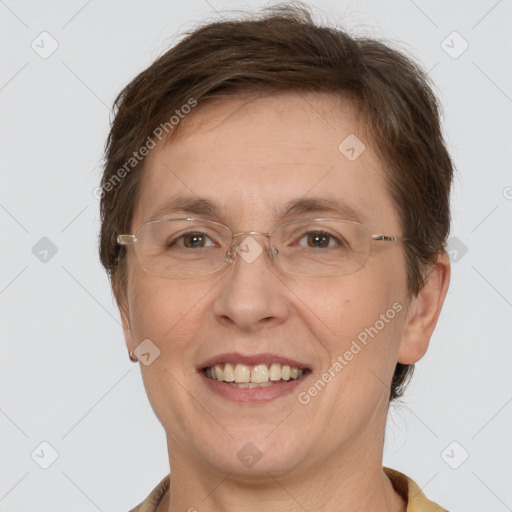 Joyful white adult female with short  brown hair and brown eyes