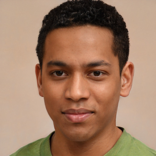 Joyful black young-adult male with short  brown hair and brown eyes