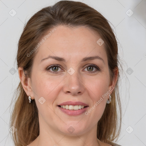 Joyful white adult female with medium  brown hair and brown eyes