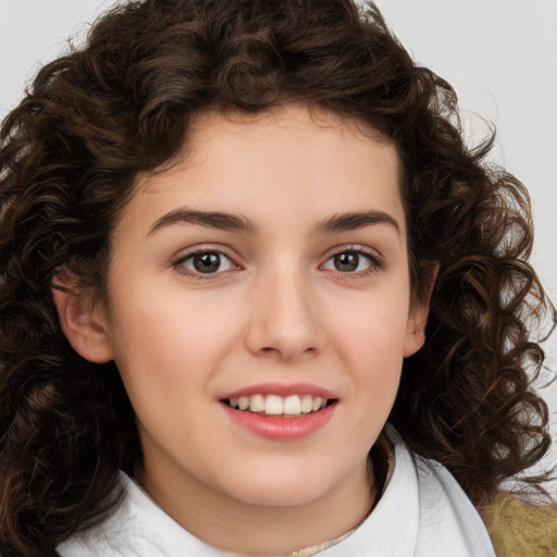 Joyful white child female with medium  brown hair and brown eyes