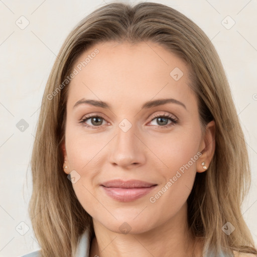 Joyful white young-adult female with long  brown hair and green eyes