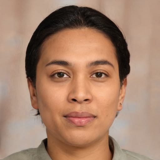 Joyful asian young-adult female with medium  brown hair and brown eyes