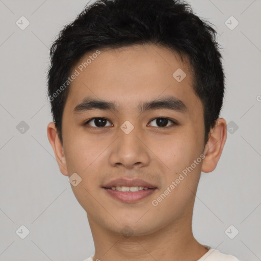 Joyful latino young-adult male with short  brown hair and brown eyes