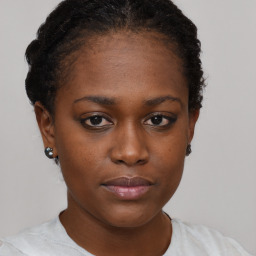 Neutral black young-adult female with short  brown hair and brown eyes