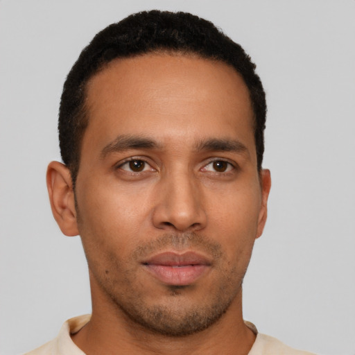 Neutral latino young-adult male with short  brown hair and brown eyes