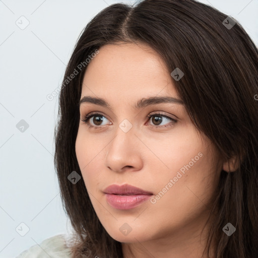 Neutral white young-adult female with long  brown hair and brown eyes