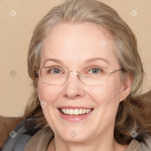 Joyful white adult female with medium  brown hair and blue eyes