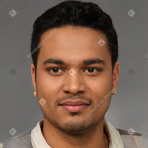 Joyful latino young-adult male with short  black hair and brown eyes