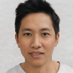 Joyful asian young-adult male with short  black hair and brown eyes