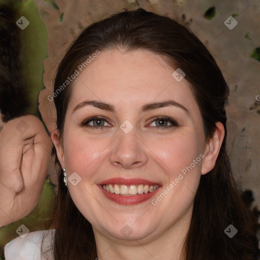 Joyful white adult female with long  brown hair and brown eyes