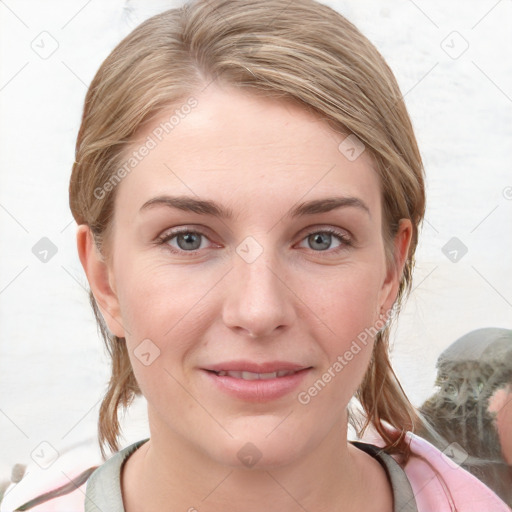 Joyful white young-adult female with medium  brown hair and blue eyes