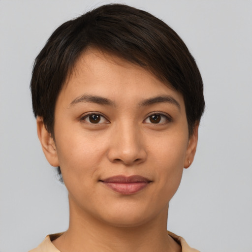 Joyful latino young-adult female with short  brown hair and brown eyes
