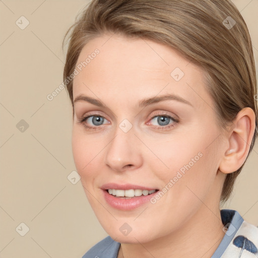 Joyful white young-adult female with medium  brown hair and blue eyes