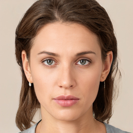 Neutral white young-adult female with medium  brown hair and green eyes