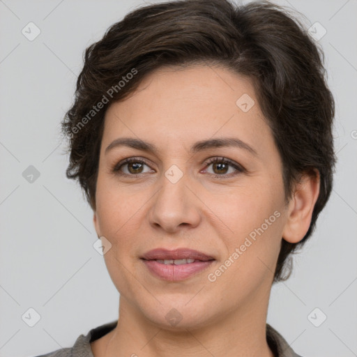 Joyful white adult female with short  brown hair and brown eyes