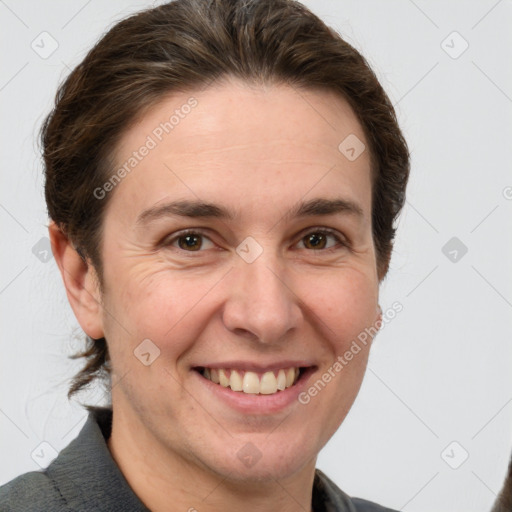 Joyful white adult female with short  brown hair and grey eyes