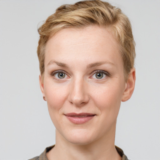 Joyful white young-adult female with short  brown hair and grey eyes