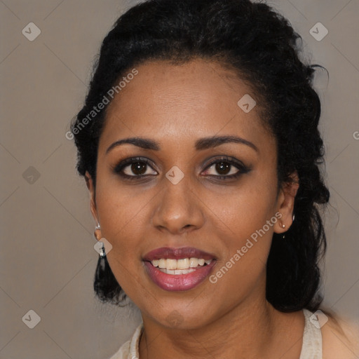 Joyful black young-adult female with long  black hair and brown eyes