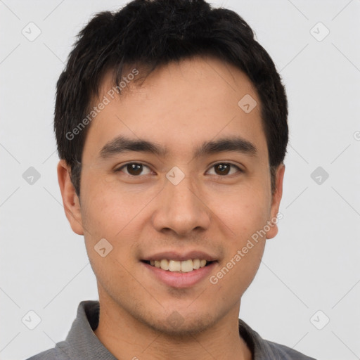 Joyful white young-adult male with short  black hair and brown eyes