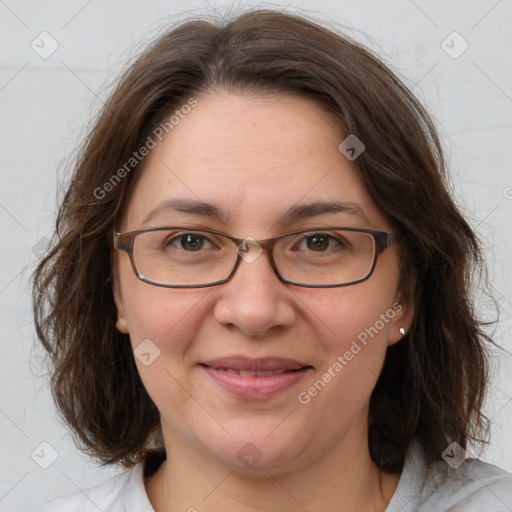 Joyful white adult female with medium  brown hair and grey eyes