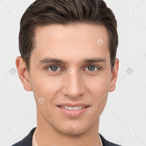 Joyful white young-adult male with short  brown hair and grey eyes