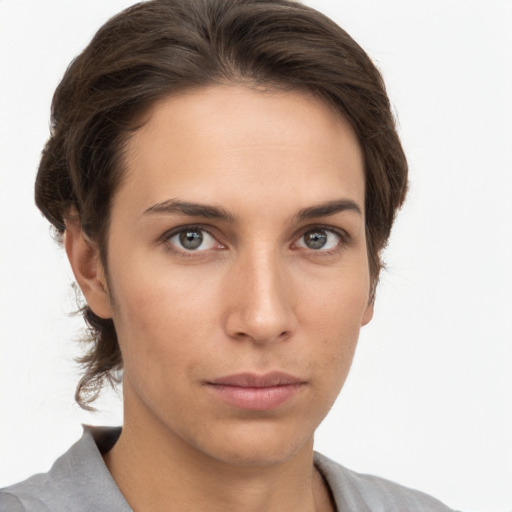 Neutral white young-adult female with medium  brown hair and brown eyes