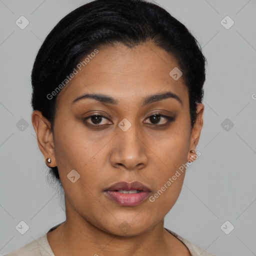 Joyful latino young-adult female with short  black hair and brown eyes