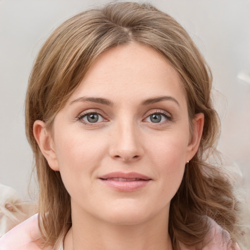 Joyful white young-adult female with medium  brown hair and blue eyes