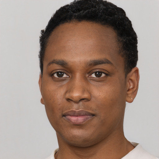 Neutral black young-adult male with short  black hair and brown eyes