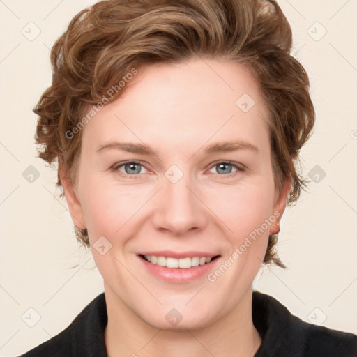 Joyful white young-adult female with medium  brown hair and blue eyes