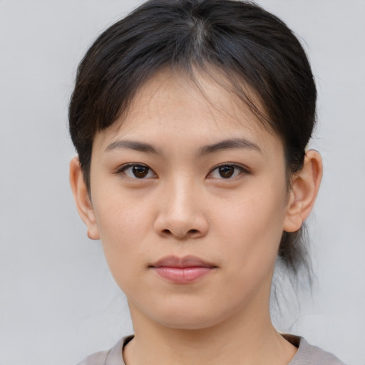 Neutral asian young-adult female with short  brown hair and brown eyes