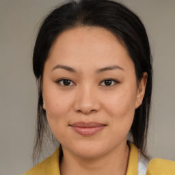 Joyful asian young-adult female with medium  brown hair and brown eyes