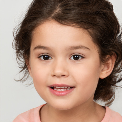 Joyful white child female with medium  brown hair and brown eyes