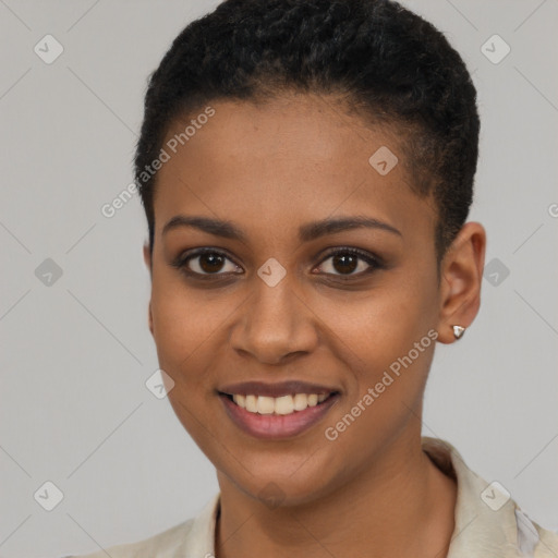 Joyful black young-adult female with short  black hair and brown eyes