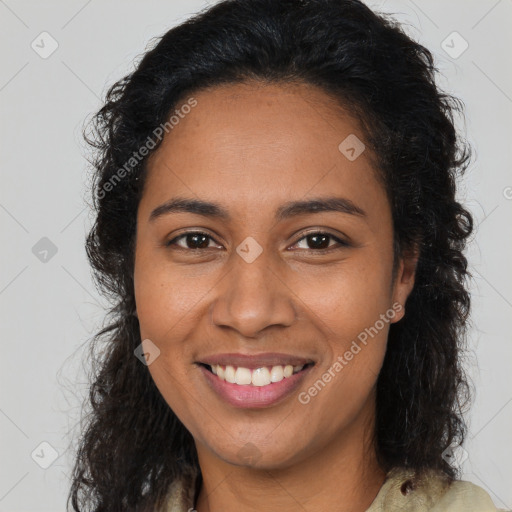 Joyful latino young-adult female with long  brown hair and brown eyes