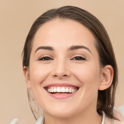 Joyful white young-adult female with medium  brown hair and brown eyes